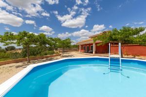 an image of a swimming pool in front of a house at Hilltop Haven by Fidalsa in Aledo