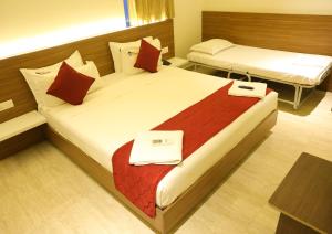 Postel nebo postele na pokoji v ubytování Hotel Amoha