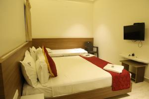 Postel nebo postele na pokoji v ubytování Hotel Amoha