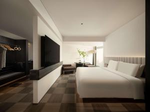 Телевізор і / або розважальний центр в SAVHE Hotel Shenzhen Riverside Times - Free night snacks and afternoon tea