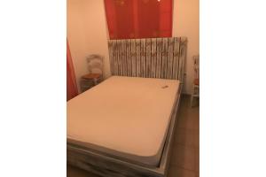 Giường trong phòng chung tại Nektarios apartment