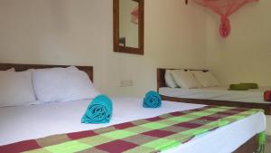 Postel nebo postele na pokoji v ubytování Eagle Safari Cottage + 37 fotografií