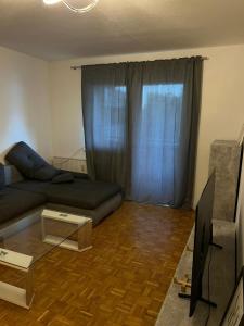 Posezení v ubytování Gemütliche Wohnung in Leonding