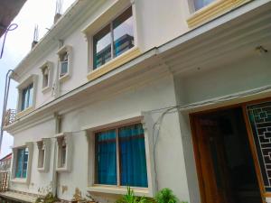 a white building with windows and a door at Hotel Kingsway Near Mall Road in Shimla