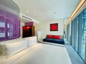 Postel nebo postele na pokoji v ubytování Wink Hotel Saigon Centre - 24hrs Lifestyle Stay + 37 fotografií