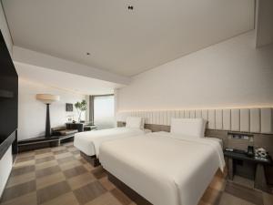Ліжко або ліжка в номері SAVHE Hotel Shenzhen Riverside Times - Free night snacks and afternoon tea