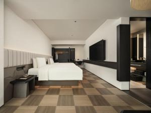 Телевізор і / або розважальний центр в SAVHE Hotel Shenzhen Riverside Times - Free night snacks and afternoon tea