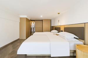 Postel nebo postele na pokoji v ubytování Yulan B&B