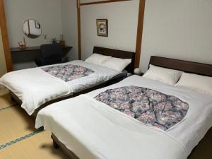 Postel nebo postele na pokoji v ubytování いやし亭 心空