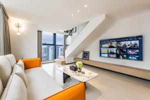TV a/nebo společenská místnost v ubytování Yulan B&B