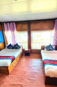 Ένα ή περισσότερα κρεβάτια σε δωμάτιο στο Mundum Farm Stay