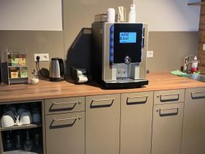 a coffee machine sitting on top of a counter at wild & bolz eMotel in Trieben