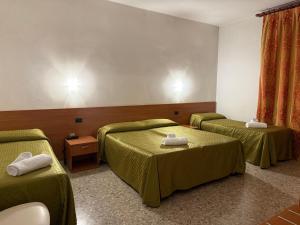 Postel nebo postele na pokoji v ubytování Hotel Villa Giusy