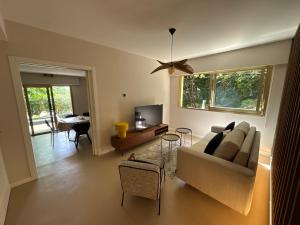 a living room with a couch and a table at Villa le Cap - Apartement in Roquebrune-Cap-Martin