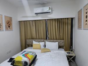 Voodi või voodid majutusasutuse Hotel Hight le mount toas