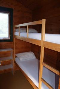 Ένα ή περισσότερα κρεβάτια σε δωμάτιο στο Camping 3 étoiles - Piscine - eeiifd