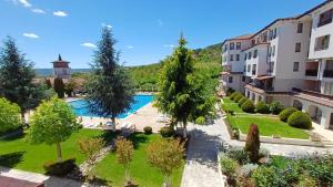 an aerial view of a courtyard with a swimming pool at Daisy Studios Harmony Hills in Rogachevo