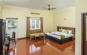Postel nebo postele na pokoji v ubytování The Cardamom Thekkady