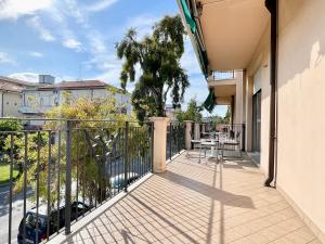 a balcony of a house with a table at 3 Camere Terrazzo e Posto Auto - Praga 36 in Rimini