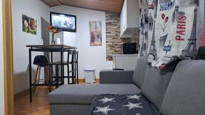 a living room with a couch and a table at Villa Olga Rosa in Las Palmas de Gran Canaria