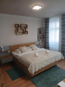 Posteľ alebo postele v izbe v ubytovaní Soda apartman