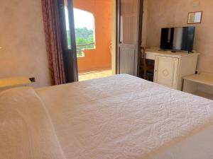Postel nebo postele na pokoji v ubytování Hotel I Ginepri
