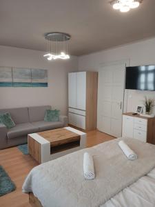 Posteľ alebo postele v izbe v ubytovaní Soda apartman