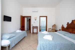 Postel nebo postele na pokoji v ubytování Bnb Villa Lucia