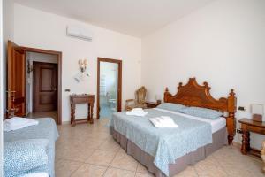Postel nebo postele na pokoji v ubytování Bnb Villa Lucia