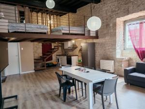 a kitchen and dining room with a table and chairs at Torretta Gottifredo in Alatri