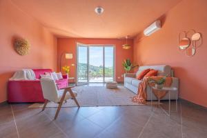 a living room with a couch and a table at Noli Hills - Grand Villa Sea View - GrandMaison in Noli