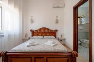 Postel nebo postele na pokoji v ubytování Bnb Villa Lucia