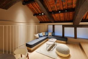 a room with a bed and a table and chairs at The 曜 Terrace in Hirado