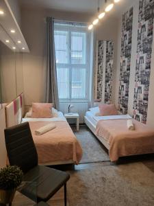 Posteľ alebo postele v izbe v ubytovaní Soda apartman