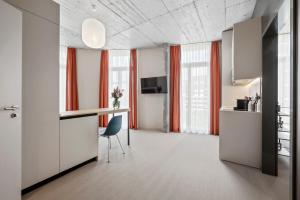 Televízia a/alebo spoločenská miestnosť v ubytovaní Ariv Design Hotel Zug