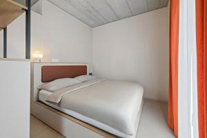 Posteľ alebo postele v izbe v ubytovaní Ariv Design Hotel Zug