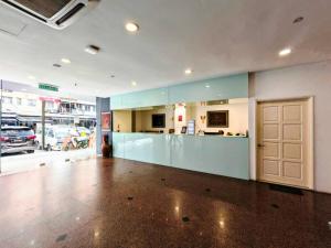 a large empty room with a door in a building at Seeds Hotel Premier Chow Kit Kuala Lumpur in Kuala Lumpur