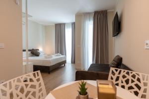 Ένα ή περισσότερα κρεβάτια σε δωμάτιο στο Bovio28studios