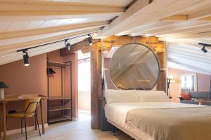 a bedroom with a large mirror and a bed at MarinoMarina - Exclusivo, Confort, Top Area Málaga in Málaga +46 photos