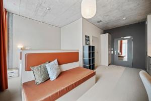 Posteľ alebo postele v izbe v ubytovaní Ariv Design Hotel Zug