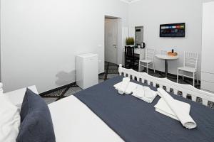 Postel nebo postele na pokoji v ubytování Hotel Fama