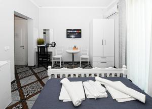 Postel nebo postele na pokoji v ubytování Hotel Fama