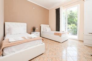 Postel nebo postele na pokoji v ubytování Hotel Fama