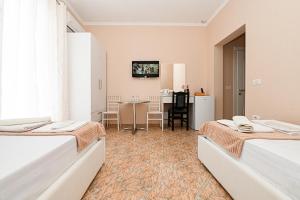 Postel nebo postele na pokoji v ubytování Hotel Fama