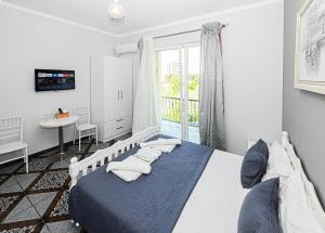 Postel nebo postele na pokoji v ubytování Hotel Fama