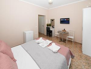 Postel nebo postele na pokoji v ubytování Hotel Fama