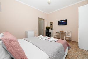 Postel nebo postele na pokoji v ubytování Hotel Fama