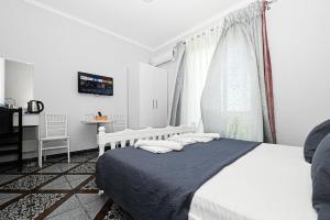 Postel nebo postele na pokoji v ubytování Hotel Fama