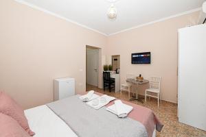 Postel nebo postele na pokoji v ubytování Hotel Fama
