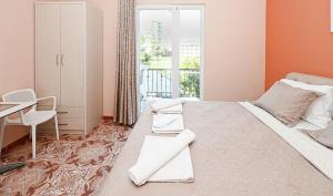 Postel nebo postele na pokoji v ubytování Hotel Fama